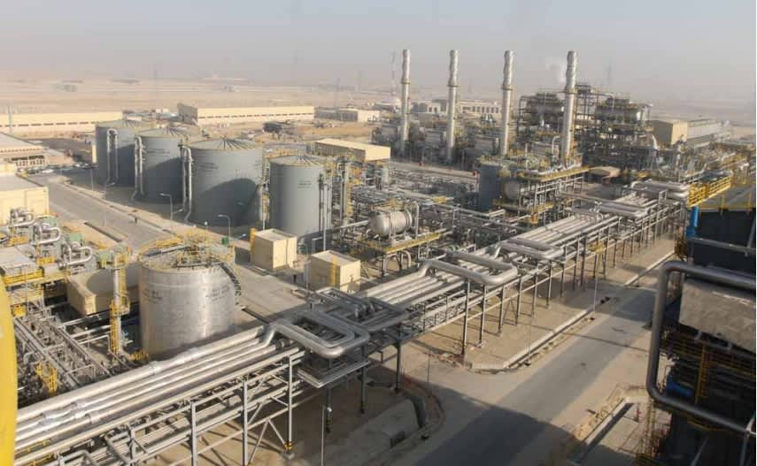 Aerial view of an industrial terminal with storage tanks and pipework at Al Jubail