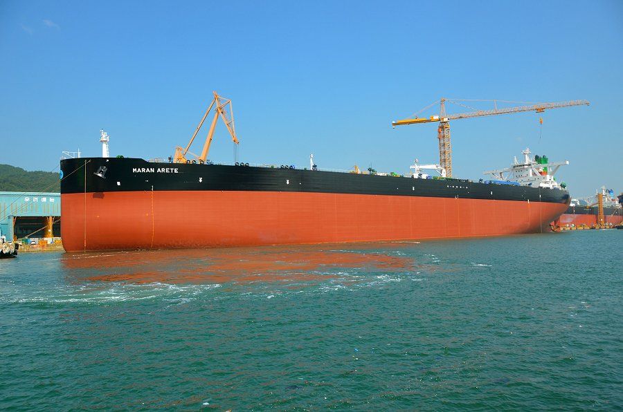 Maran Arete at the shipyard, broadside view with the vessel's name visible