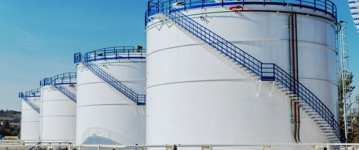 Row of white oil storage tanks at a Jeddah terminal