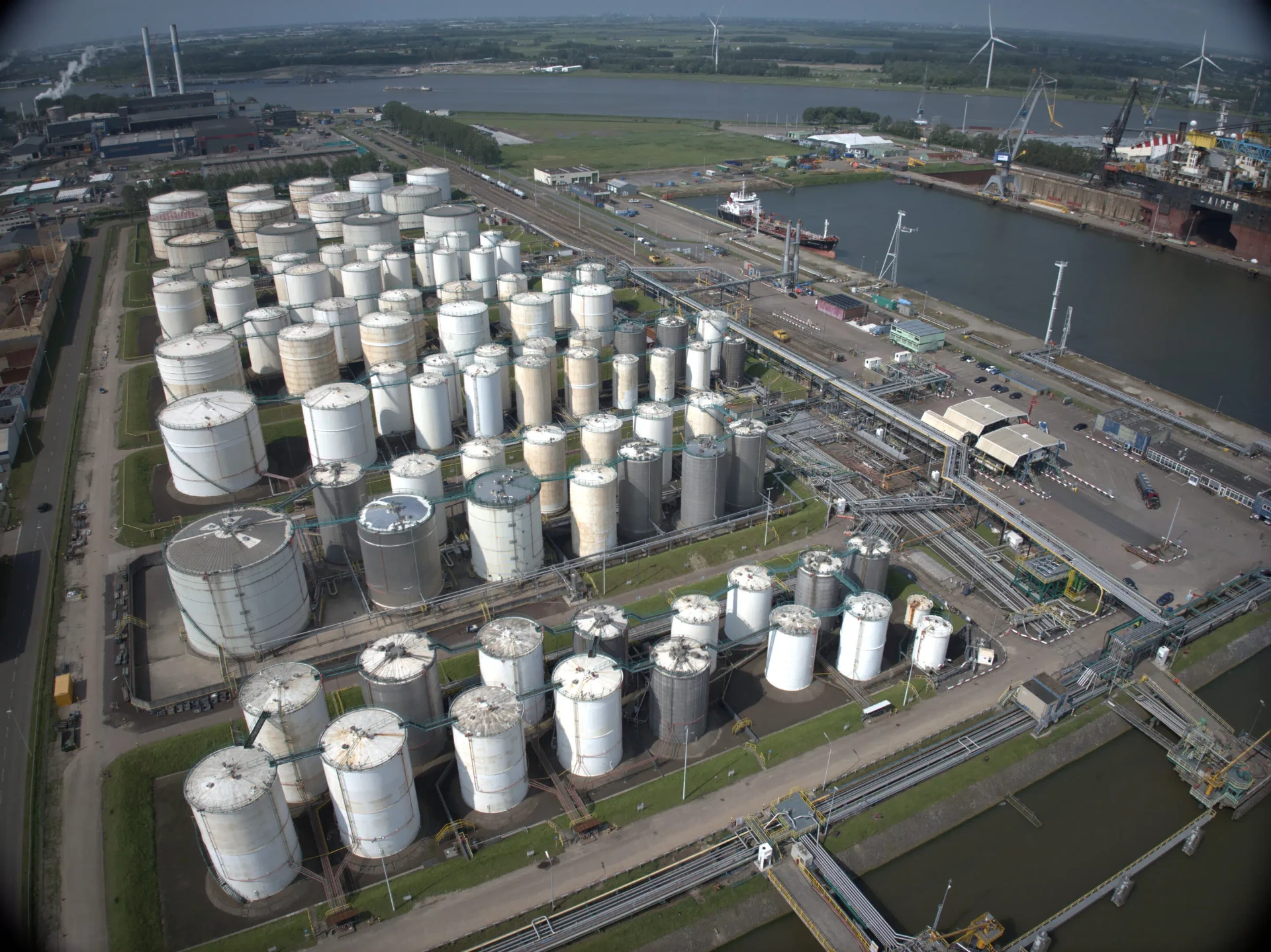 Aerial view of storage tank rows and jetties at Rotterdam, Netherlands